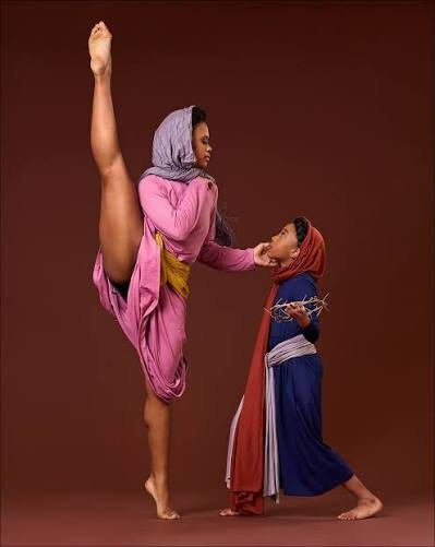 Amoni duet with young student dancer